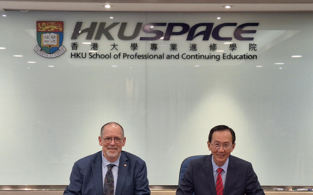 The School Signs Memorandum of Understanding with Queen's University 