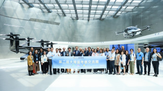 Group photo of the delegation visiting the XPeng Motors’ AEROHT exhibition hall