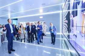 Professor William K.M. Lee, Director, experiencing interactive technology at the Vipshop digital showroom