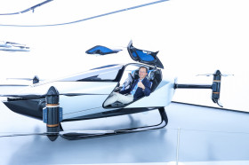 Professor William K.M. Lee, Director, test-riding XPeng's flying vehicle 