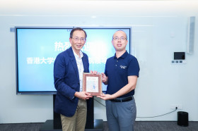 Exchange of souvenirs between Professor William K.M. Lee, Director, and Mr Yun Pan, Marketing Director, Midea Cloud of Midea Group