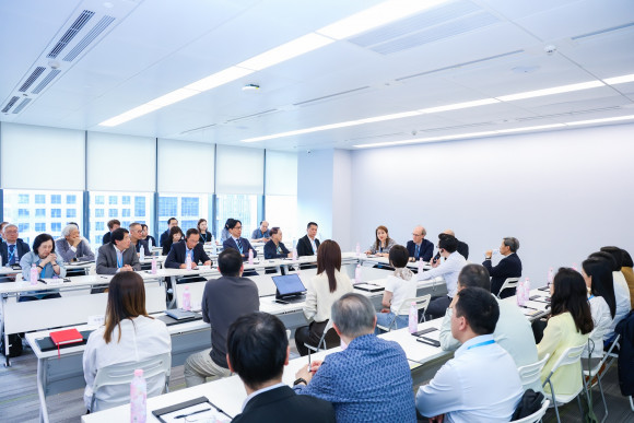 The delegation participating in a discussion with Miniso Group